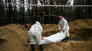 Ukraine finds graves and 'torture centres' in recaptured east