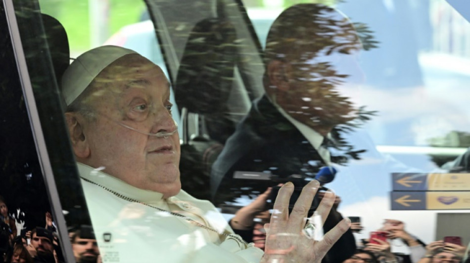 Tired-looking pope leaves hospital, thanks faithful 