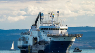 Migrants come ashore at Italian port as another ship appeals to France