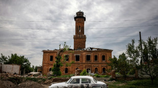 Russia presses Donbas assault, claims capture of key town