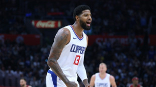 George late show sparks Clippers over Cleveland