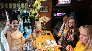 Tourists get taste of old Japan at hidden 'snack bars'