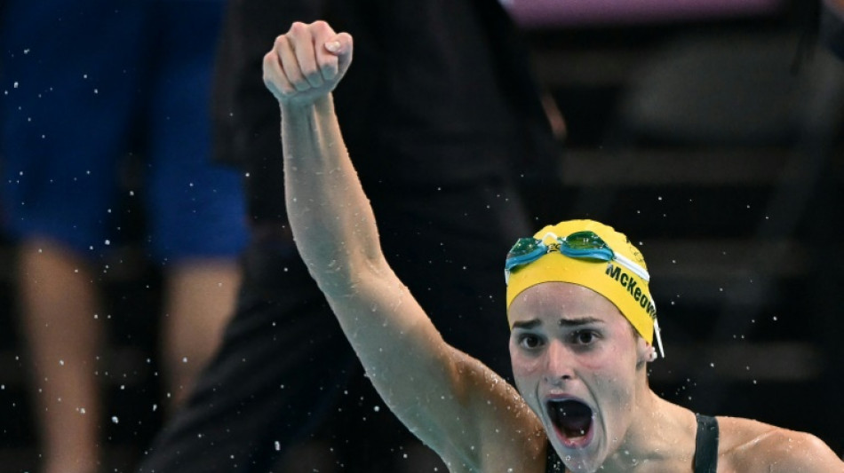 Australia's McKeown roars back to retain 100m backstroke gold