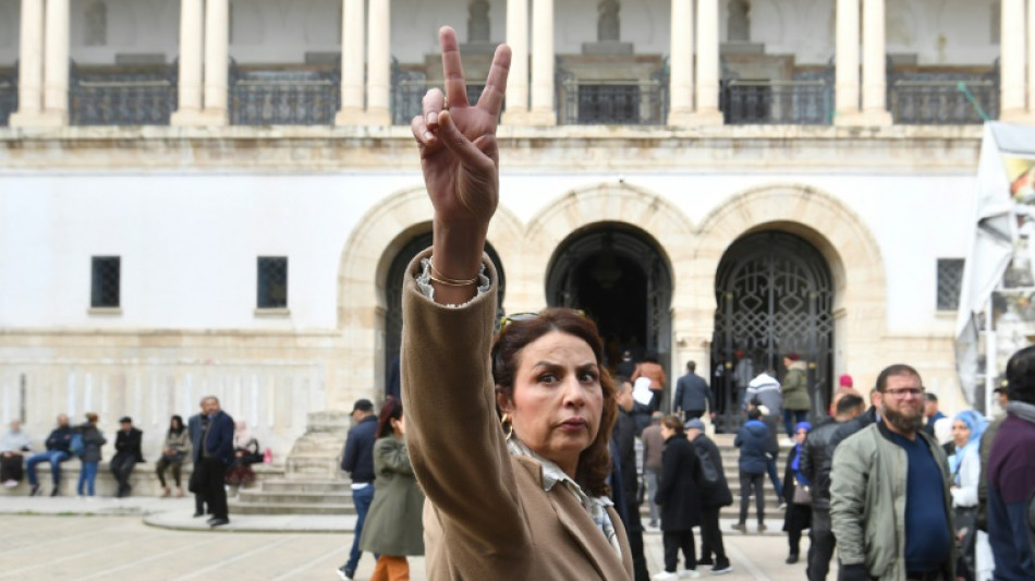 Tunisia puts opposition figures on mass trial decried as 'absurdity'