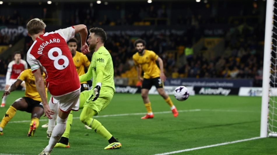 'Back to business' Arsenal grind out Wolves win to go top