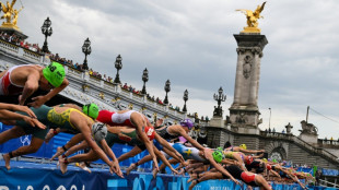 Women triathletes dive into River Seine at Paris Olympics