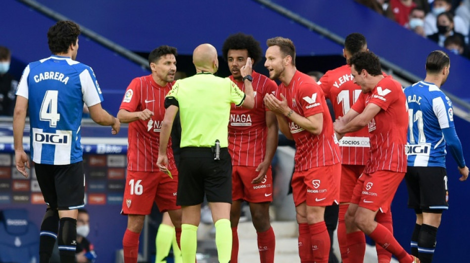 Sevilla lose ground to Madrid after draw at Espanyol