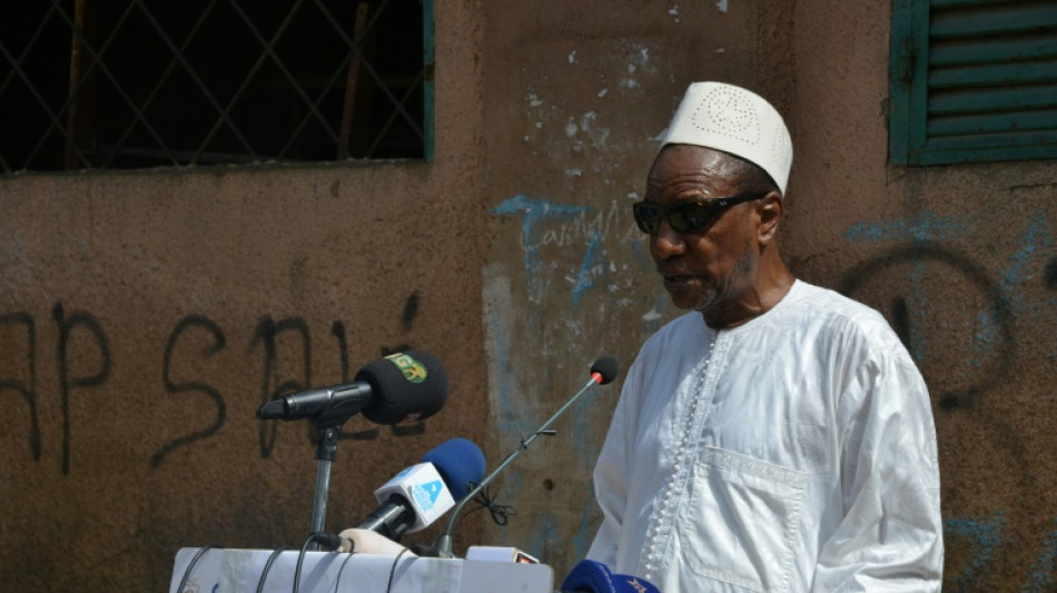 Guinea's ousted ex-president returns after treatment abroad