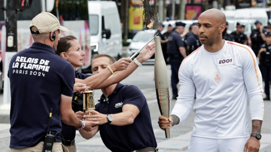 Olympic torch relay seeks to win over sceptical Parisians