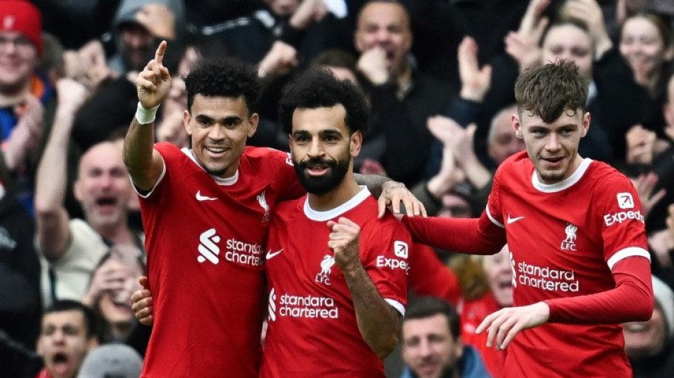 Salah caps fightback as Liverpool go top