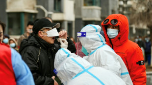 China locks down city of 9 million as virus ripples across country