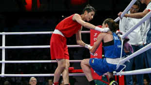 Taiwanese boxer in Olympics gender row wins to guarantee medal