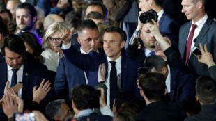 Relief, not joy, at low-key Macron election party