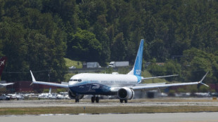 Boeing reports huge loss on defense contract woes