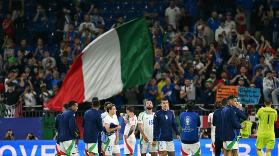 Italy down after Spain humbling, but not out