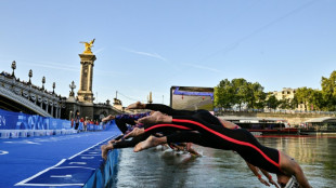 Olympic swimmers plunge into Seine, Lyles eyes sprint double