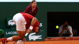 Djokovic injury shakes up French Open as Swiatek roars into semis